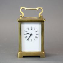 A brass carriage clock, understood to be in working order, H. 14cm.