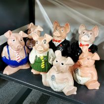 A group of seven Nat West pigs.