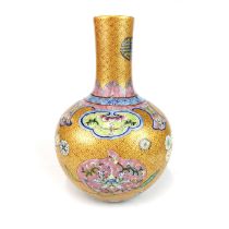 A finely decorated Chinese hand enamelled porcelain vase with famille rose colours, H. 26cm.