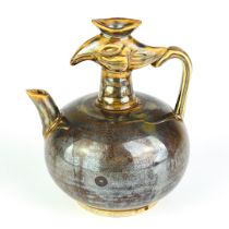 A Chinese brown pottery water dropper. H. 14cm.
