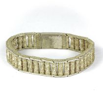 A Chinese white metal bracelet with rotating character links, L. 22cm.
