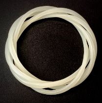 A rare Chinese milk glass four piece bangle imitating white jade. Each bangle 4mm, internal dia.