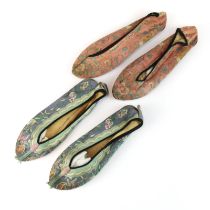 Two pairs of old Chinese embroidered silk ladies shoes, L. 24cm.