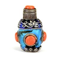 A Sino-Tibetan enamelled white metal snuff bottle, H. 7cm.