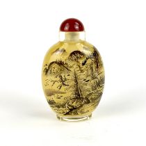 A Chinese inside painted snuff bottle with a red glass stopper, H. 8.7cm.