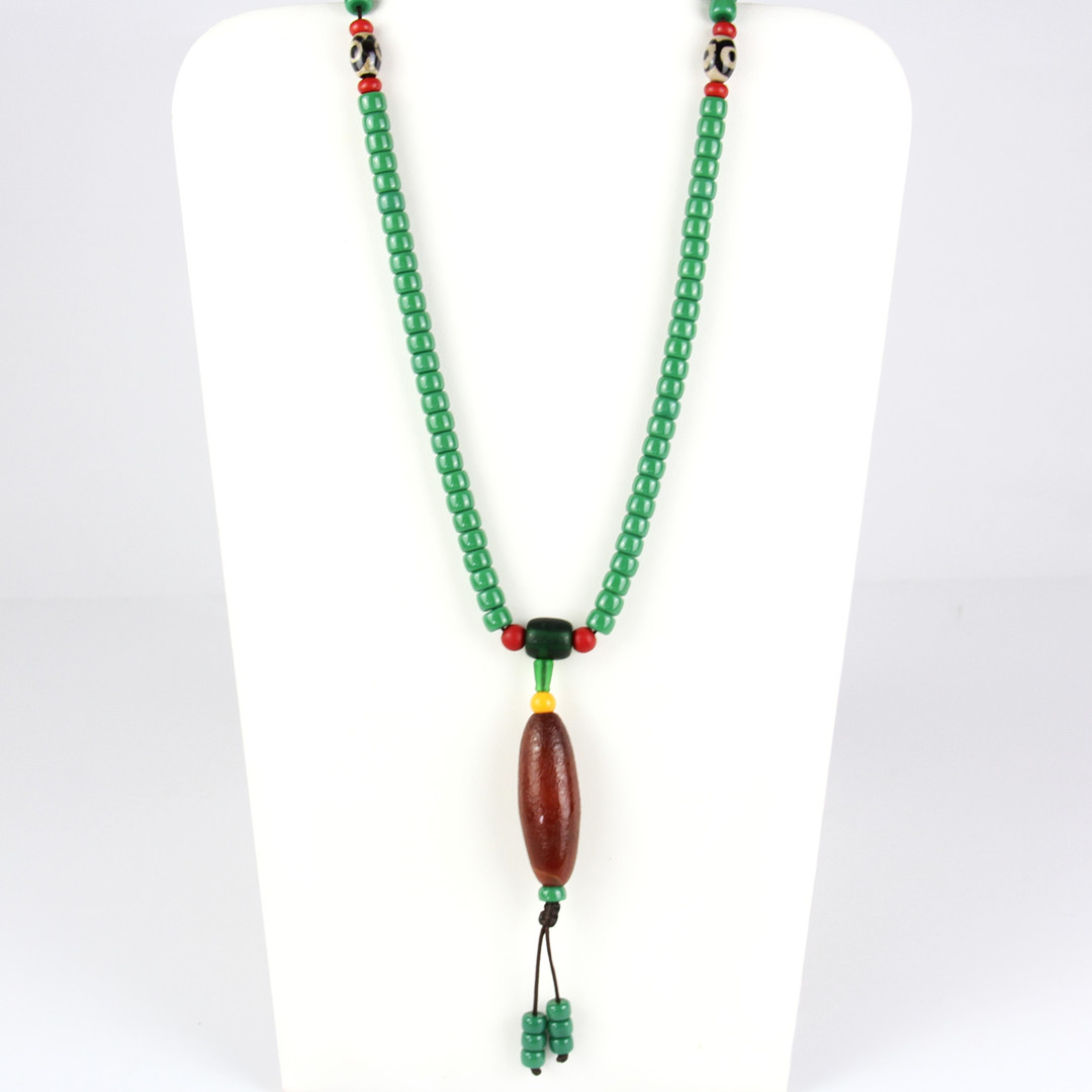 A string of Tibetan green glass prayed beads, folded L. 51cm.