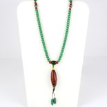 A string of Tibetan green glass prayed beads, folded L. 51cm.