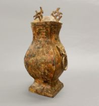 A Chinese archaic form lidded censer, H. 28cm.