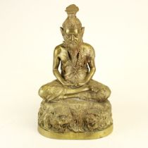 A bronzed brass figure of a seated deity, H. 41.5cm.