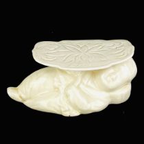 A Chinese white porcelain Putai pillow.