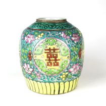 An early 20th century Chinese Canton enamelled ginger jar, decorated with a character of double