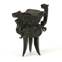 An archaic form bronze wine cup. H. 13.5 cm.