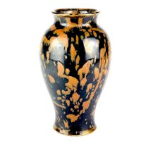 A Chinese black and brown glazed pottery vase. H. 22cm.