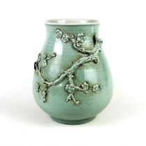 An unusual Chinese hand-potted relief decorated celadon glazed vase, H. 23cm.