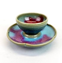 A Chinese Zhun glazed tea bowl and saucer, saucer Dia. 12cm.