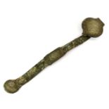 An archaic form bronze ruyi sceptre inset with jade. L. 30 cm.