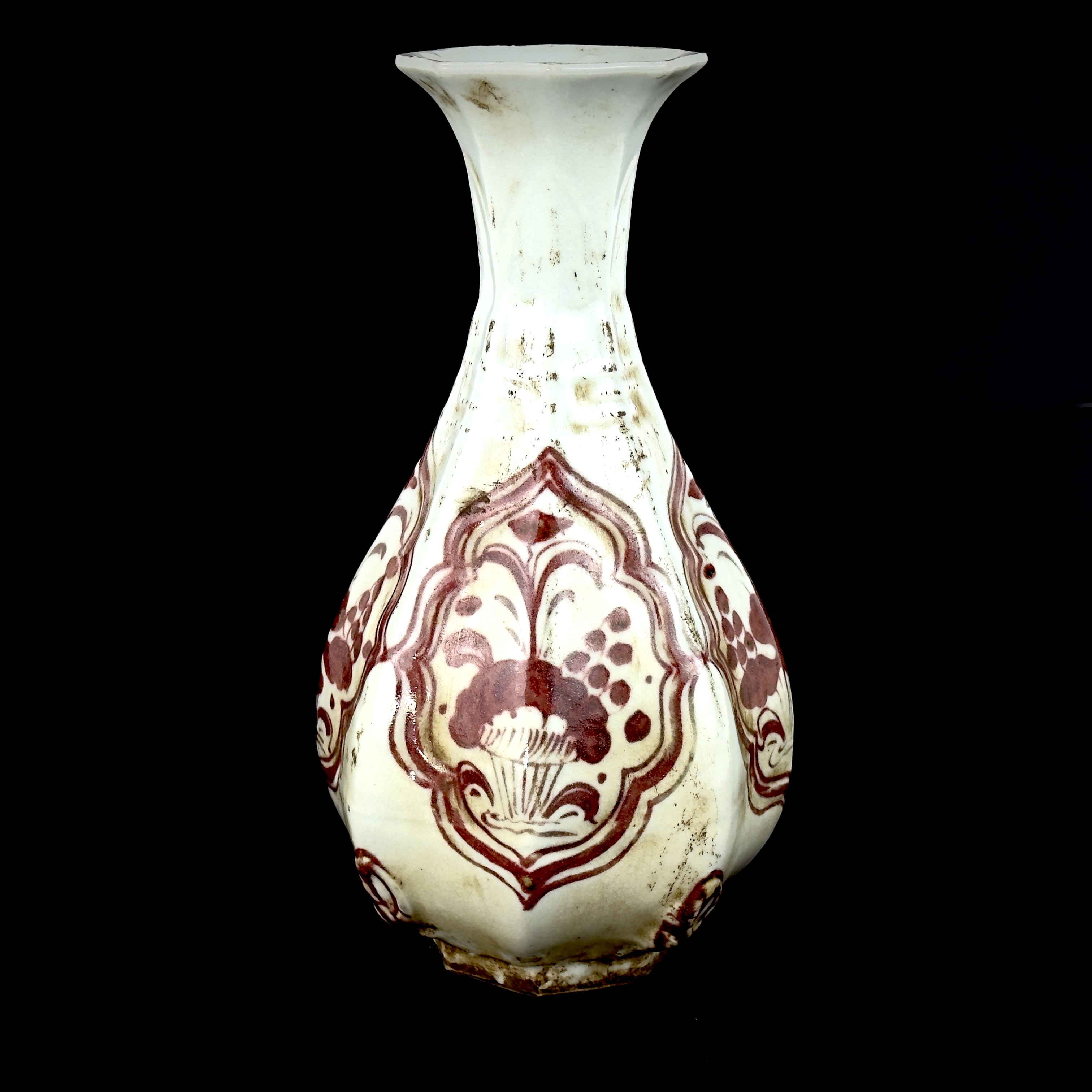 A Chinese hexagonal porcelain vase with under-glaze iron red decoration, H. 24cm.