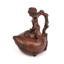 A Chinese naturalistic peach shaped Yixing terracotta teapot, H. 17cm.
