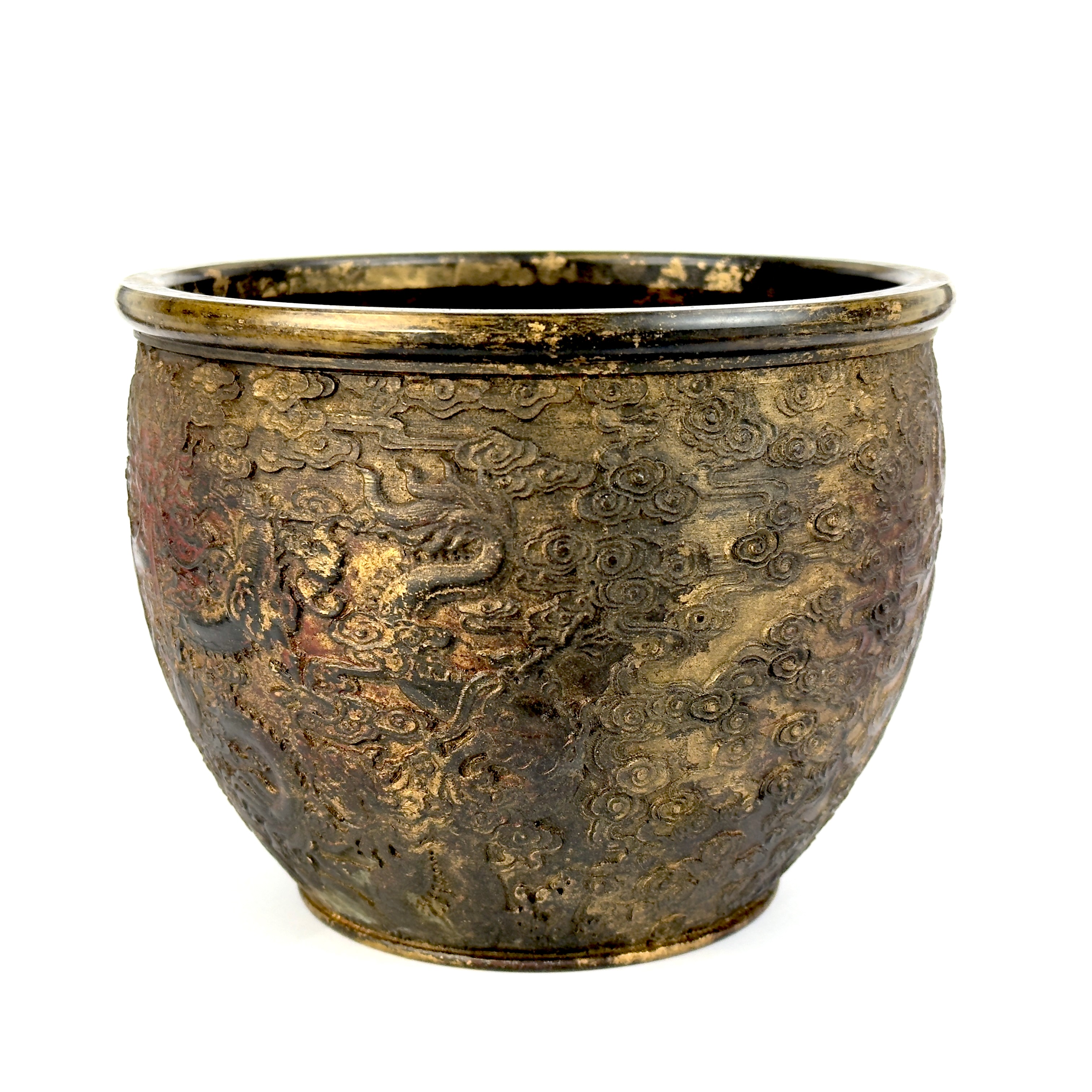 A cold painted and gilt Chinese bowl with relief decoration of dragons and signature to base, Dia.