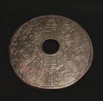 A Chinese carved stone pi disc, Dia. 30cm.