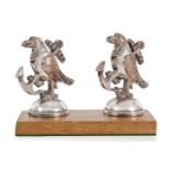 A PAIR OF BANDMASTER'S MUSIC STAND FINIALS FROM H.M.S. HOOD, CIRCA 1920