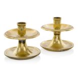 A PAIR OF WEIGHTED BRASS YACHT CANDLE STICKS, CIRCA 1900