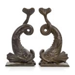 A PAIR OF 19TH CENTURY CAST BRASS DOLPHIN BOOK ENDS