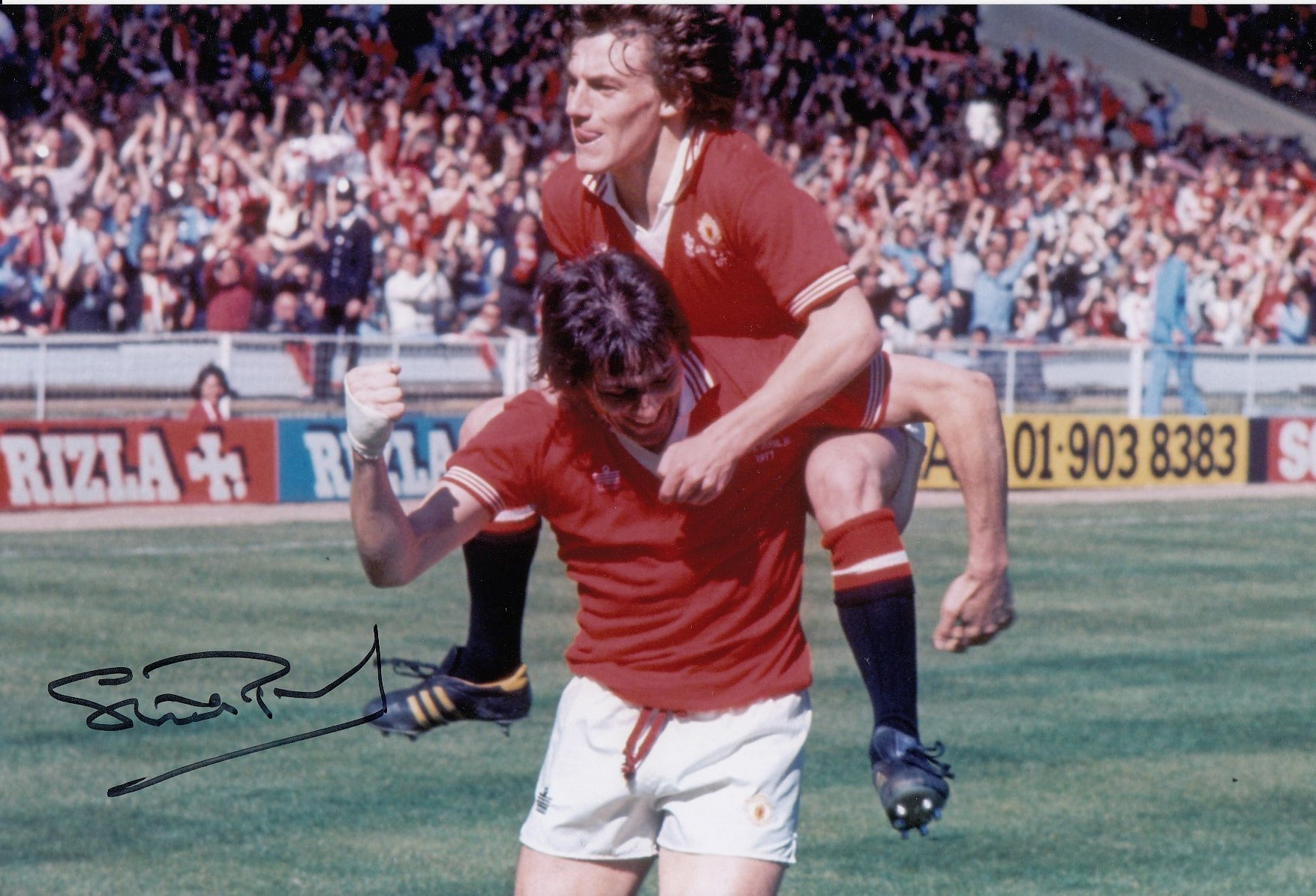 Autographed Stuart Pearson 12 X 8 Photo - Col, Depicting Steve Coppell Leaping Upon Team Mate Stuart