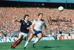 Autographed Trevor Brooking 12 X 8 Photo - Col, Depicting Trevor Brooking Of England Being Closely