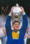 Autographed John Lukic 12 X 8 Photo - Col, Depicting Leeds United Goalkeeper John Lukic Holding