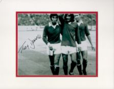 Former Manchester Utd Star Tony Dunne Signed Black and White Photo, Housed in a Mount Measuring 14 x