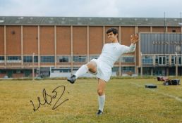 Autographed Mick Bates 12 X 8 Photo - Col, Depicting Leeds United Midfielder Mick Bates Striking A