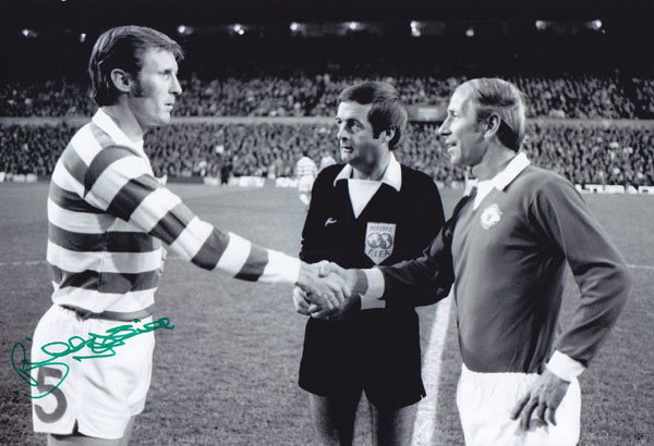 Autographed Billy McNeill 12 X 8 Photo - B/W, Depicting Man United Captain Bobby Charlton Shaking