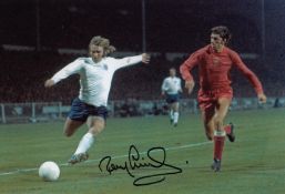 Autographed Tony Currie 12 X 8 Photo - Col, Depicting England's Tony Currie Crossing The Ball During