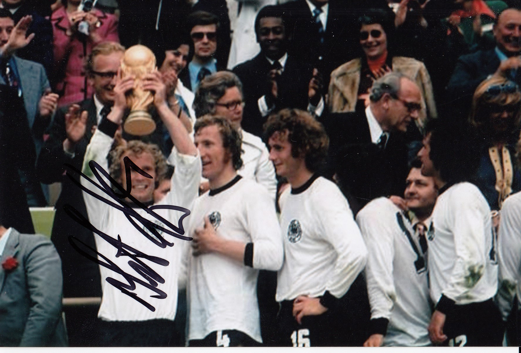 Autographed Bertie Vogts 6 X 4 Photo - Col, Depicting West Germany's Bertie Vogts Holding Aloft