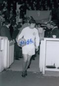 Autographed John Giles 12 X 8 Photo - B/W, Depicting Leeds United Captain John Giles Leading His