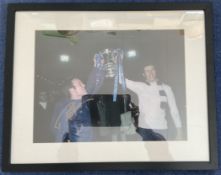 Football Ron 'Chopper' Harris Signed 16x12 inch Colour Print Showing Harris and one other Lifting