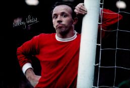 Football. Nobby Stiles Signed 12x8 inch Colour Man Utd FC Photo. Signed in silver ink. Good