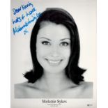 Melanie Sykes signed 10x8 black and white photo dedicated. All autographs come with a Certificate of