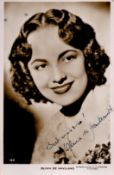 Olivia De Haviland Signed 5x3 inch approx Black and White Photo. Signed in blue ink. Good Condition.