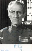 Peter Cushing Signed 8 x 5 inch Black and White Image. Signed in blue ink, dedicated. Good