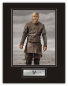 Stunning Display! Vikings Travis Fimmel hand signed professionally mounted display. This beautiful