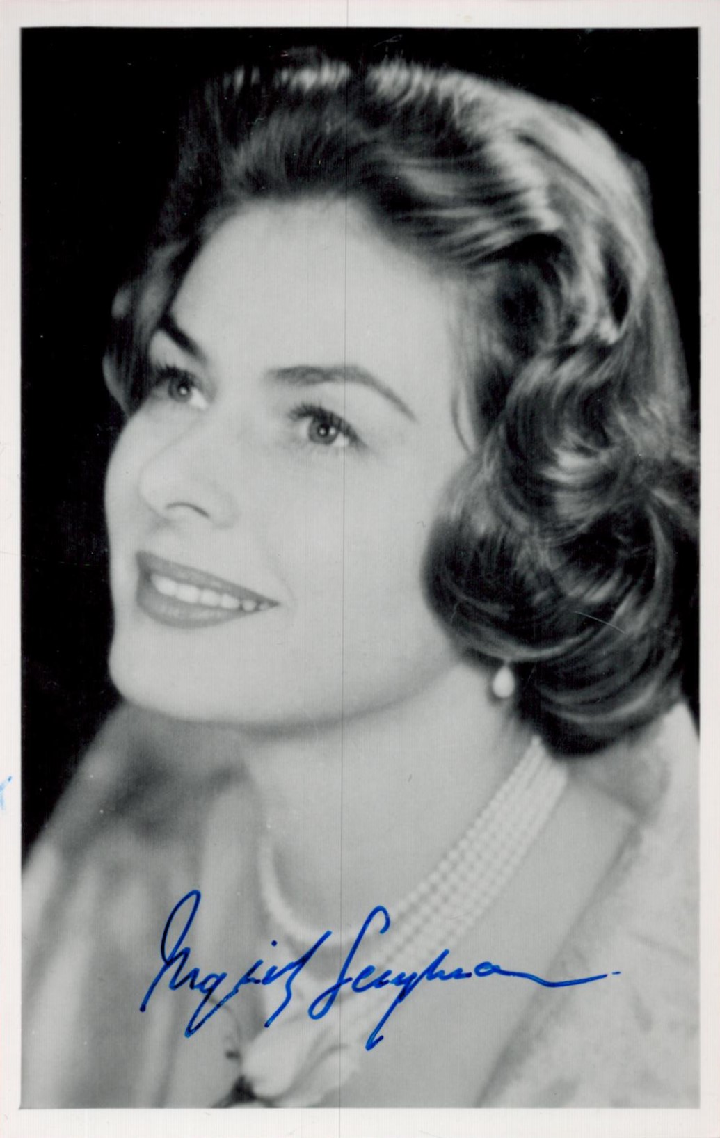 Ingrid Bergman Signed 5 x 3 inch approx Black and White Photo. Signed in blue ink. Good Condition.