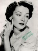 Gene Tierney Signed 10 x 8 inch Black and White Photo. Signed in green ink. Good Condition. All