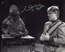 Doctor Who 8x10 scene photo signed by Nabil Shaban as Sil. All autographs come with a Certificate of