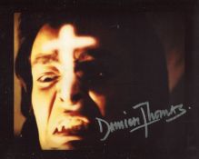 Dracula horror movie 8x10 scene photo signed by Damien Thomas. All autographs come with a