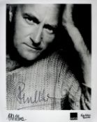 Phil Collins signed 10x8 black and white promo photo. Good Condition. All autographs come with a