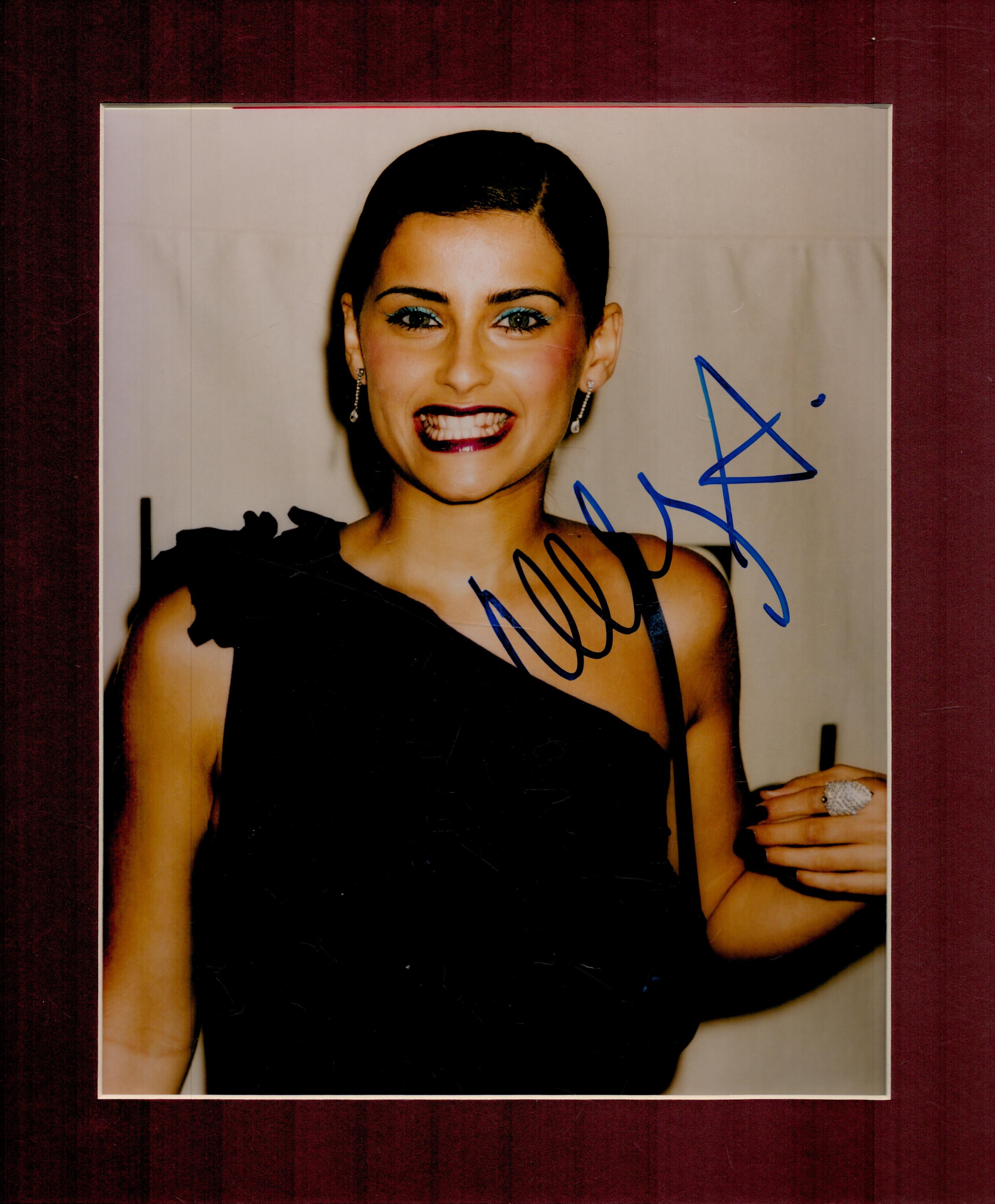 Nelly Furtado signed 12x10 overall mounted colour photo. Good Condition. All autographs come with