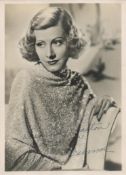 Irene Dunne Signed 7 x 5 inch Vintage Black and White Photo. Signed in blue ink, dedicated. Fair