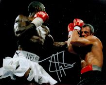 Boxing Johnny Nelson signed 10x8 colour photo pictured in action in a world title defence. Good
